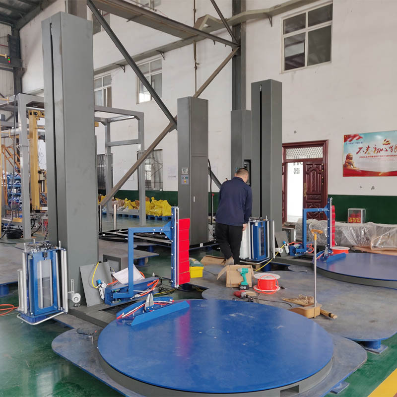 Automatic stretch pallet wrapping machines